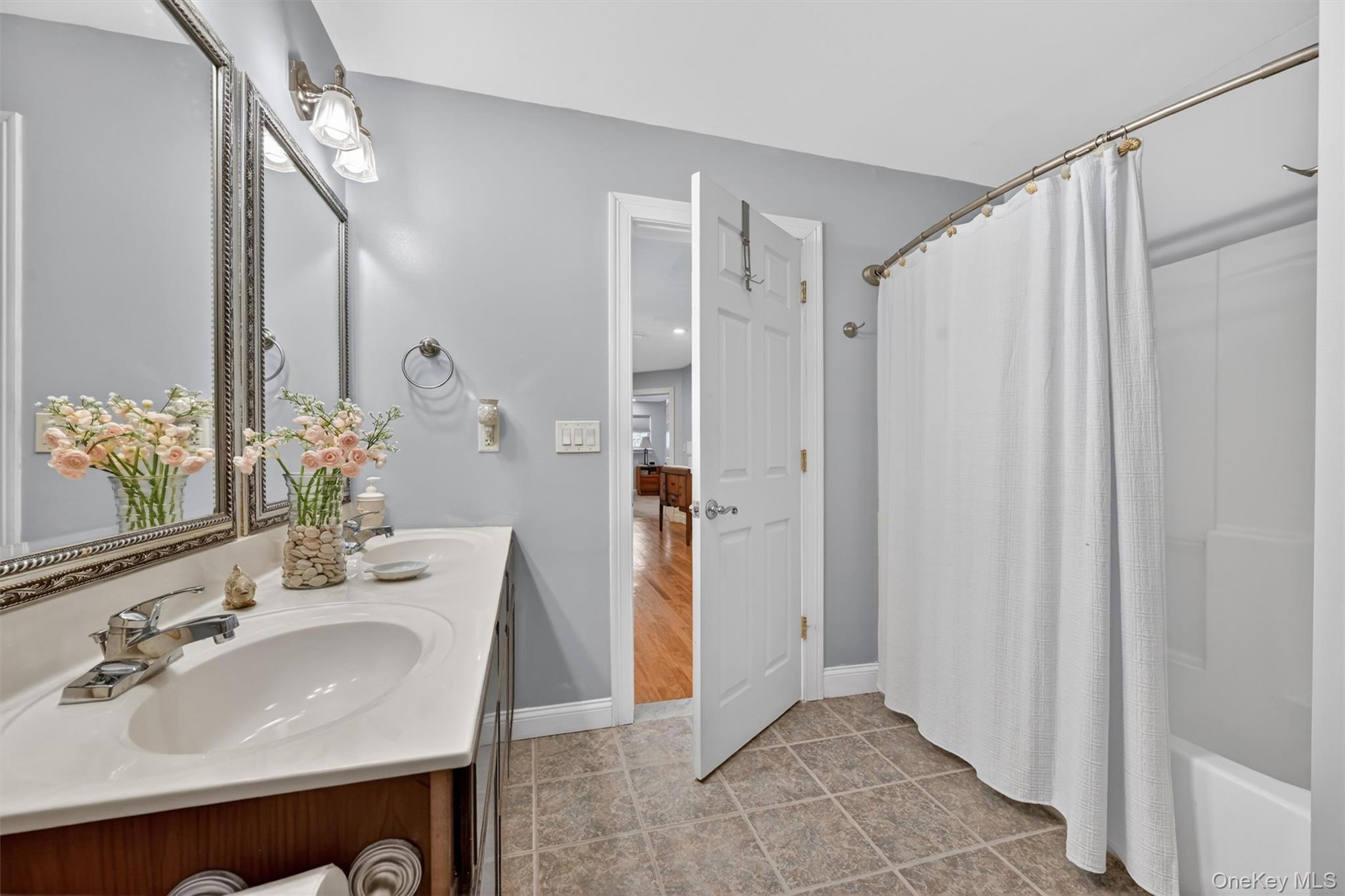 47 Willets Way Newburgh, NY 12550 - Photo 42 of 50 a bathroom with a sink a mirror and a shower