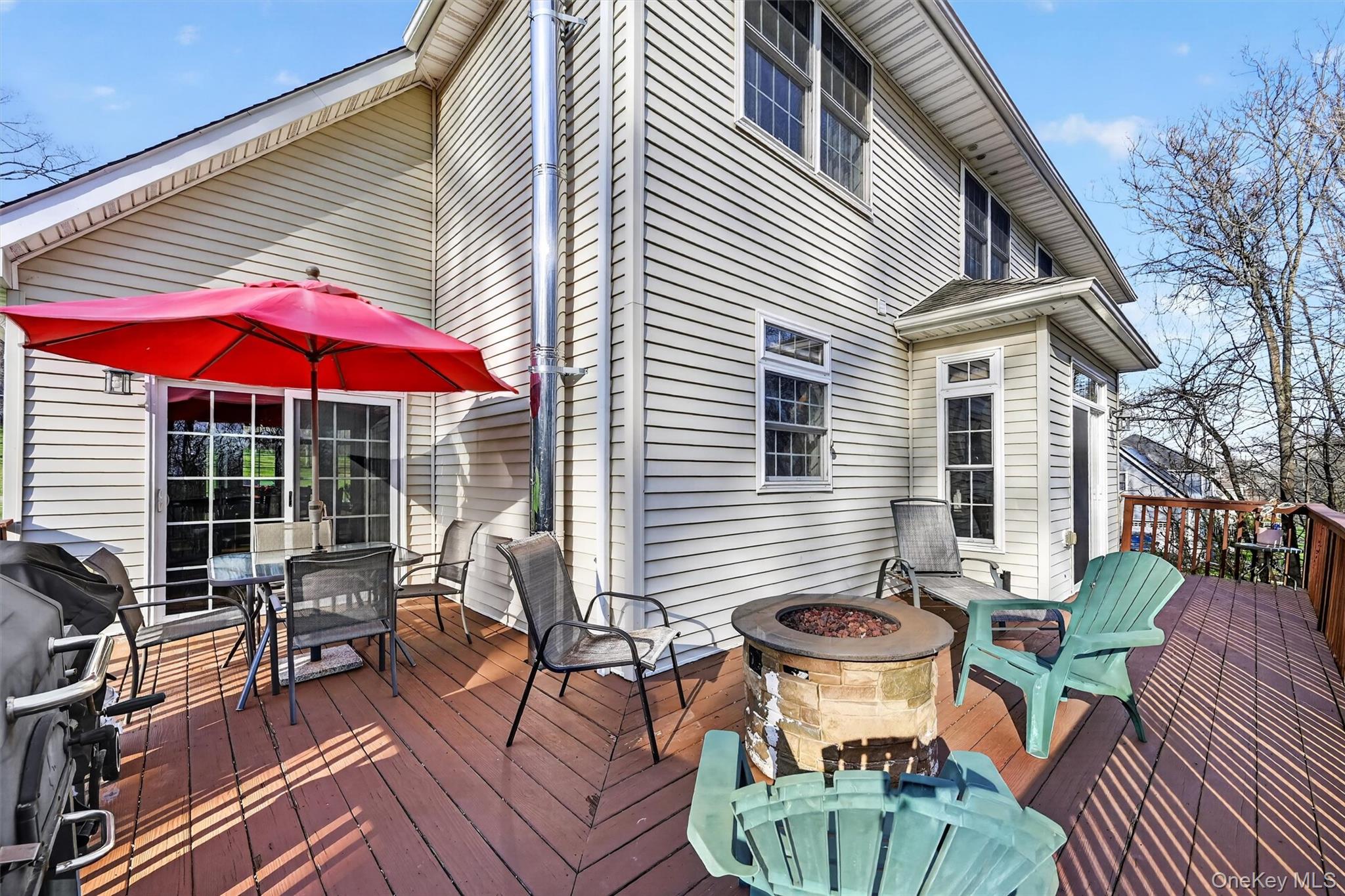 47 Willets Way Newburgh, NY 12550 - Photo 45 of 50 a view of a house with a table and chairs in patio