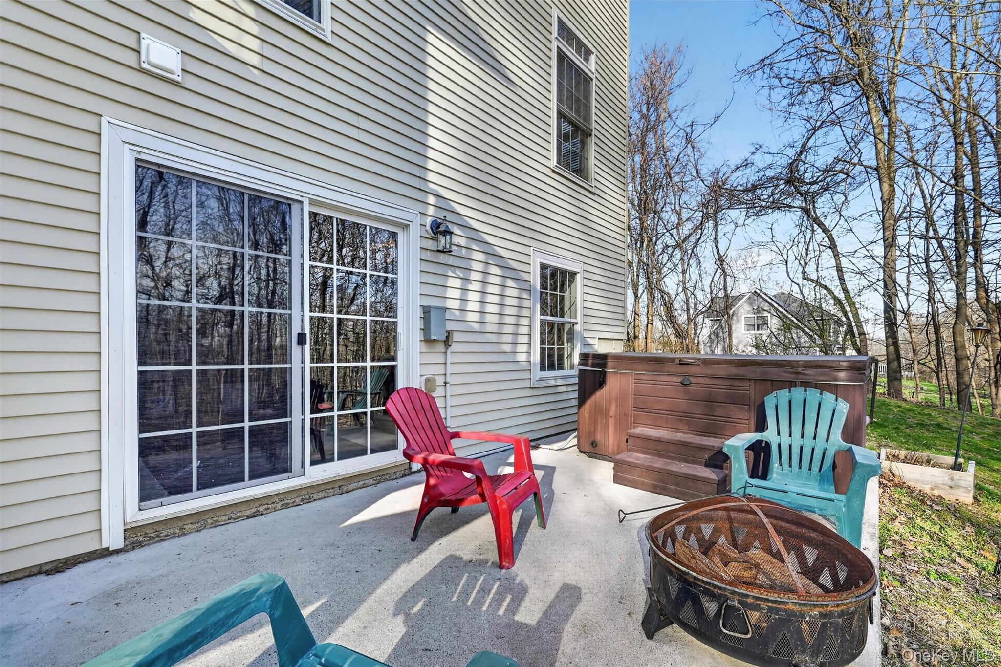 47 Willets Way Newburgh, NY 12550 - Photo 47 of 50 a view of a chair and table in the back yard of the house