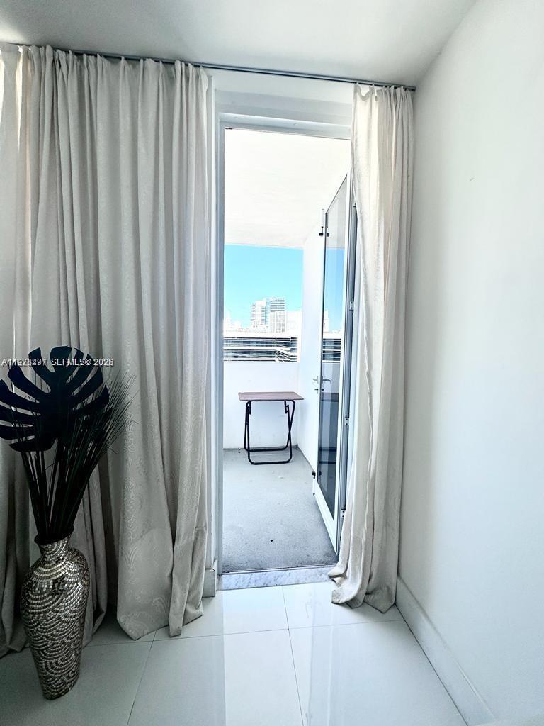 100 Lincoln Road, Unit 1404 Miami Beach, FL 33139 - Photo 12 of 18 a view of a livingroom with furniture and a porch