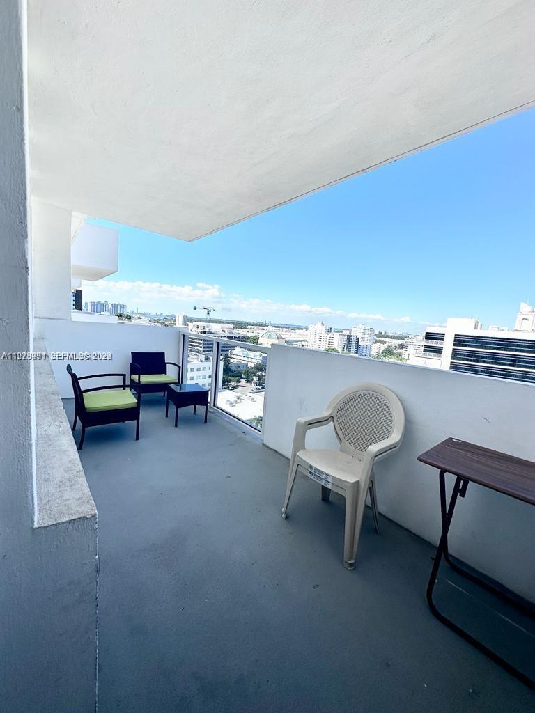 100 Lincoln Road, Unit 1404 Miami Beach, FL 33139 - Photo 13 of 18 a view of a workspace with furniture and a chair