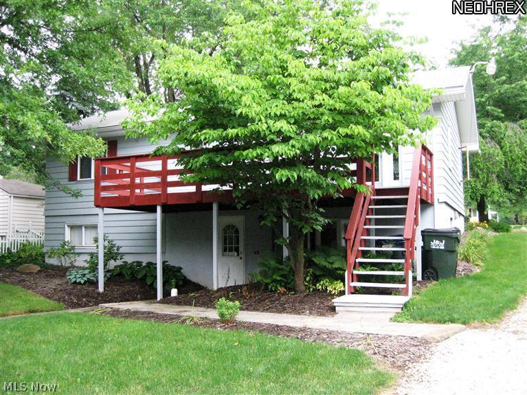 3110 Dutt Road Barberton, OH 44203 - Photo 20 of 21 Back photo of home features nice deck and walk-out lower level.