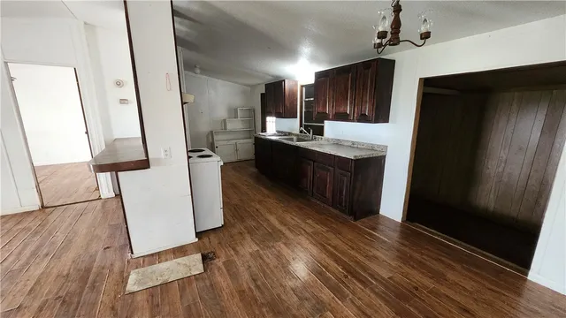 a view of a kitchen from the hallway