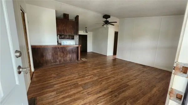 a view of a kitchen from the hallway