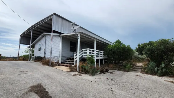 a view of a house with a yard and garage