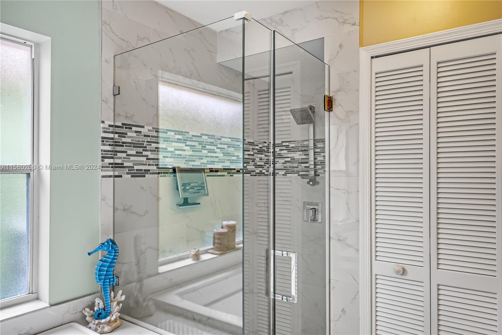 147 Stonebriar Boulevard Jupiter, FL 33458 - Photo 24 of 39 a bathroom with a shower