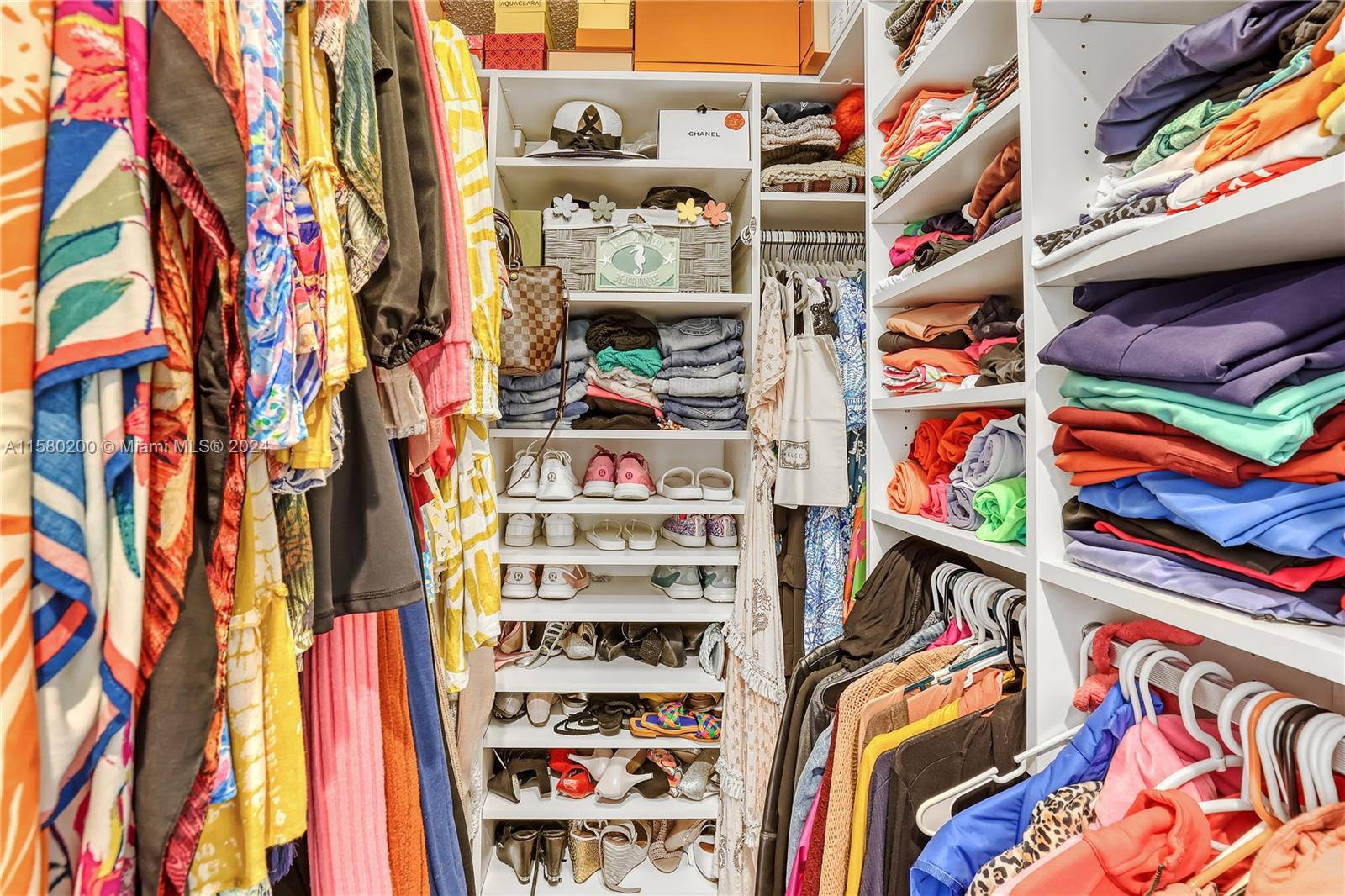 147 Stonebriar Boulevard Jupiter, FL 33458 - Photo 25 of 39 a view of walk in closet with clothes and shoes