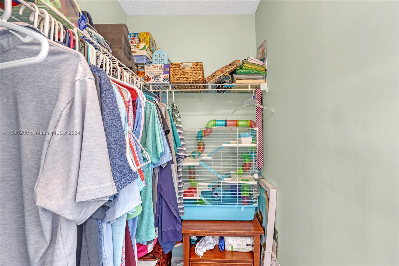 147 Stonebriar Boulevard Jupiter, FL 33458 - Photo 27 of 39 a room with lots of stuff and hardwood floor
