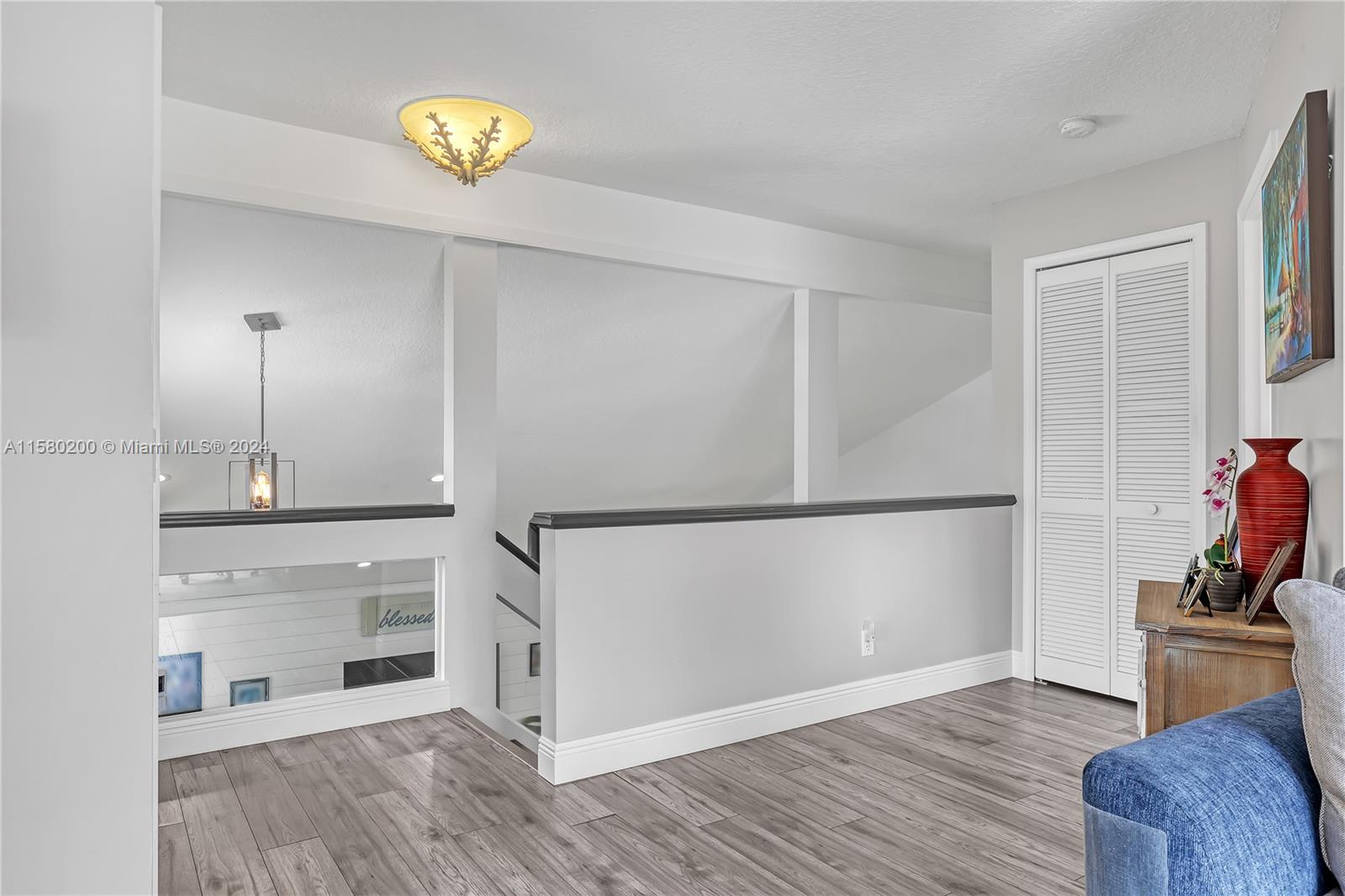 147 Stonebriar Boulevard Jupiter, FL 33458 - Photo 32 of 39 a view of empty room with wooden floor