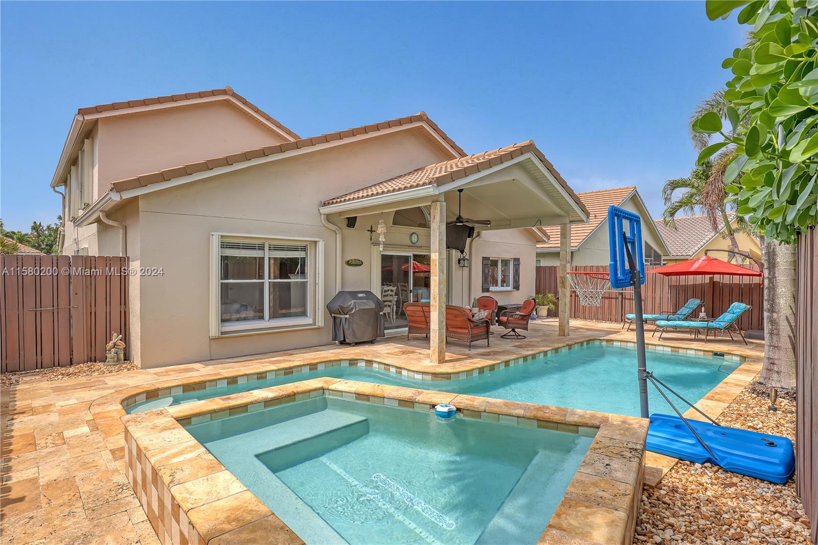 147 Stonebriar Boulevard Jupiter, FL 33458 - Photo 38 of 39 a view of a house with swimming pool and sitting area