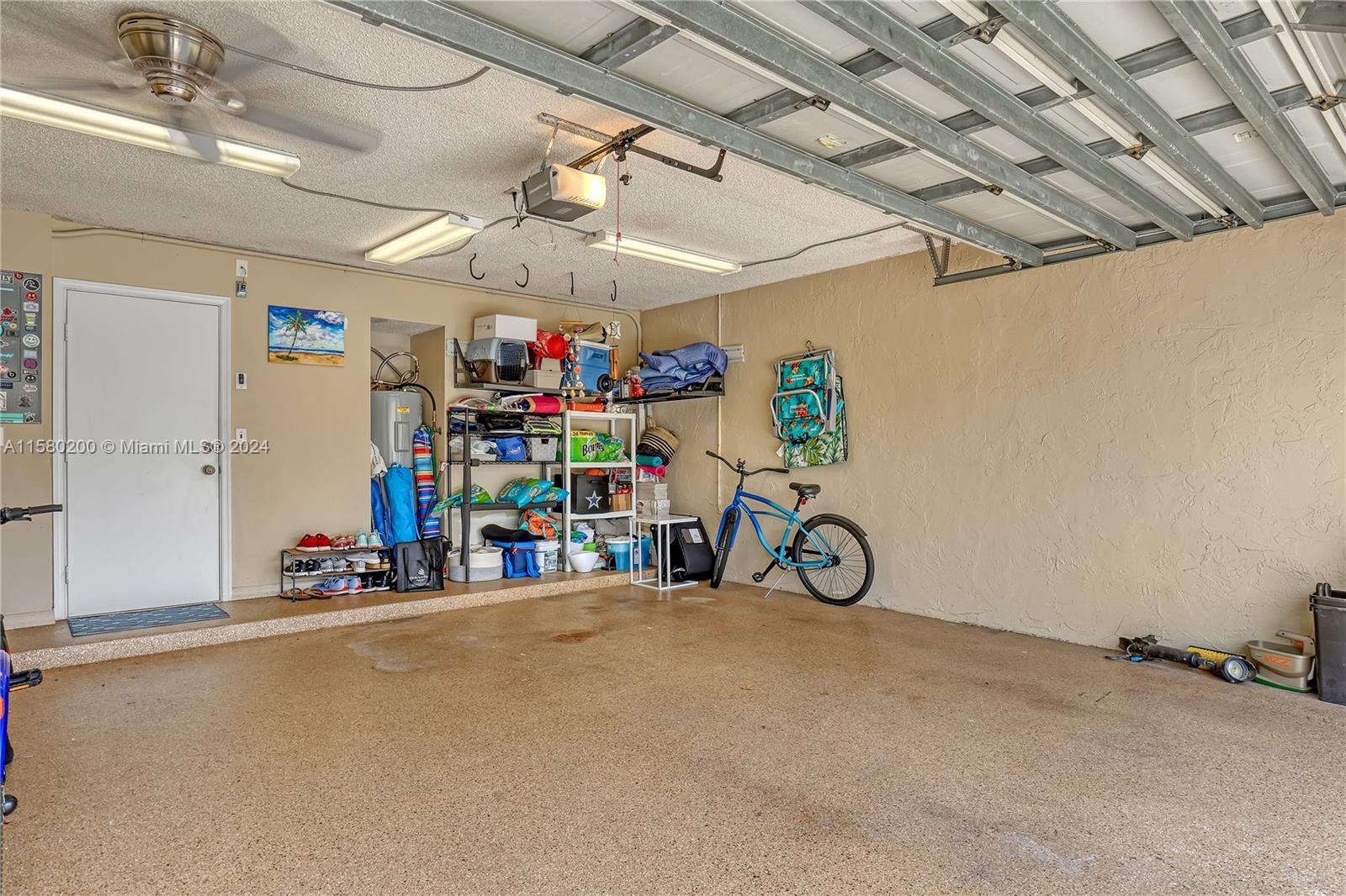 147 Stonebriar Boulevard Jupiter, FL 33458 - Photo 39 of 39 a view of garage with a bike