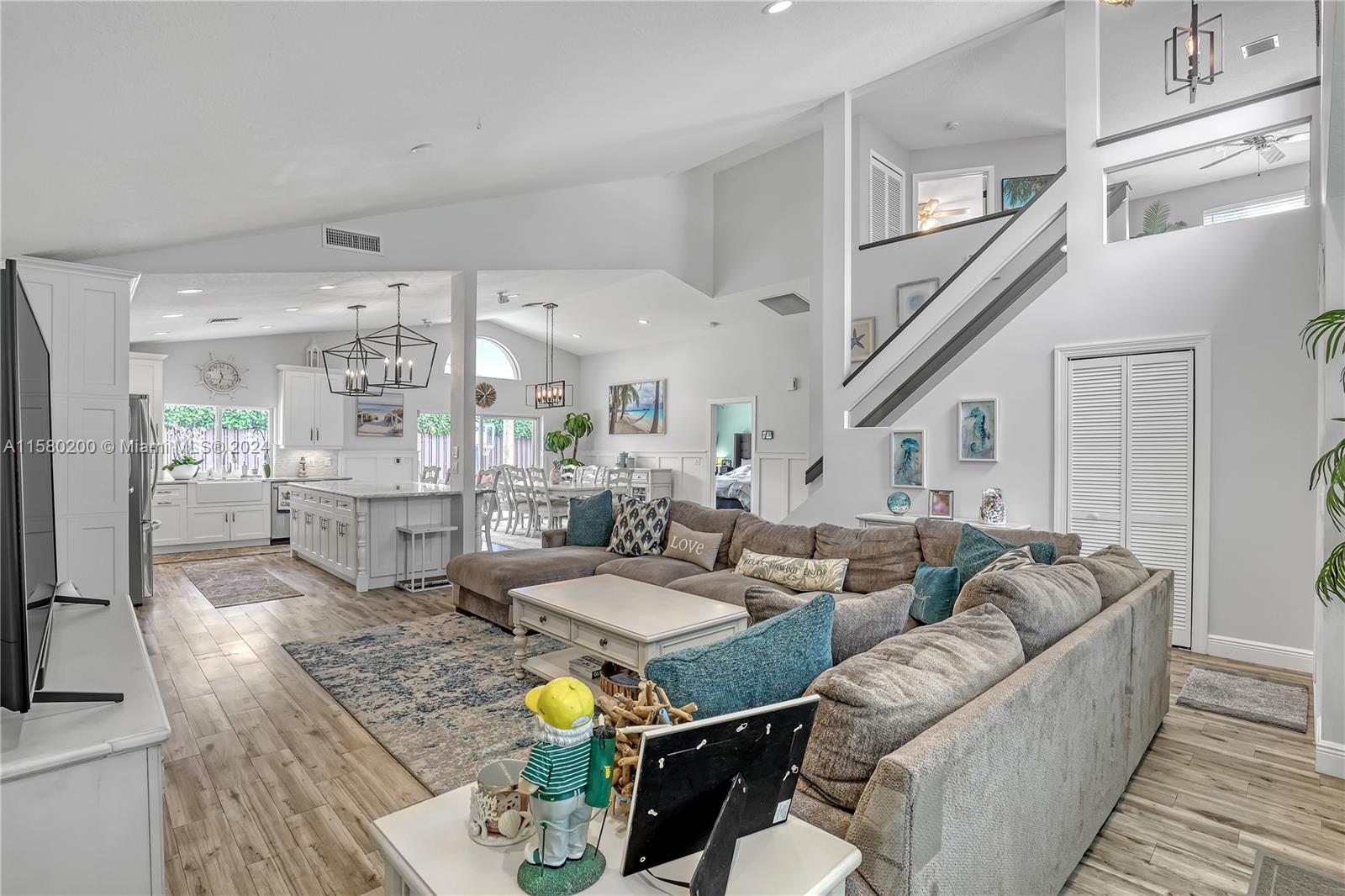 147 Stonebriar Boulevard Jupiter, FL 33458 - Photo 8 of 39 a living room with furniture and wooden floor