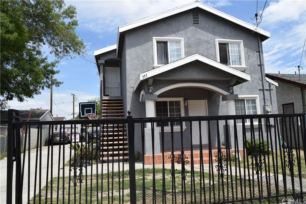 111 East Cedar Street Compton, CA 90220 - Photo 3 of 7 a front view of a house with a balcony
