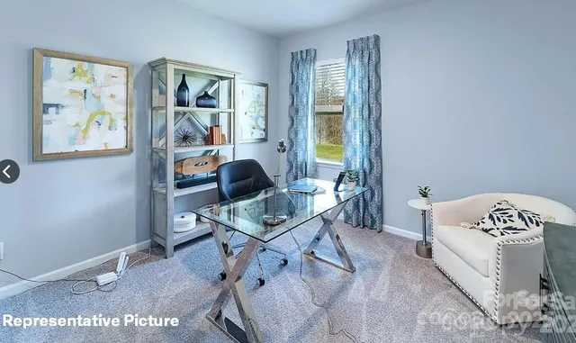 a workspace with furniture and window