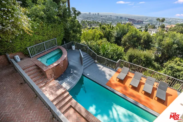 a view of a two chairs in the balcony