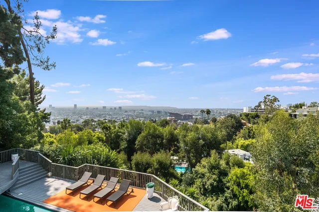 a view of a swimming pool with a yard