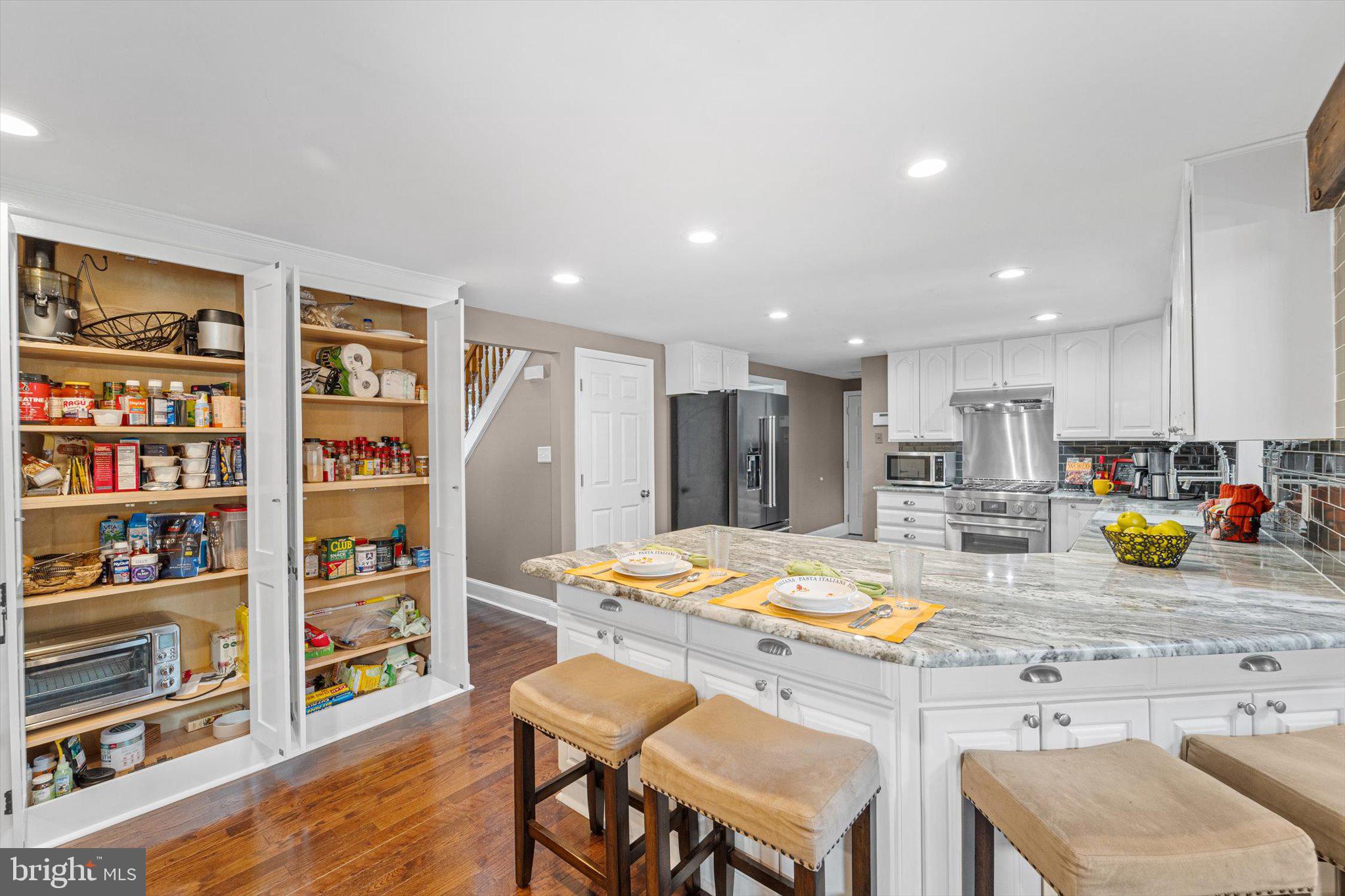 7561 Vogels Way Springfield, VA 22153 - Photo 27 of 79 PANTRY INTERIOR & BREAKFAST BAR