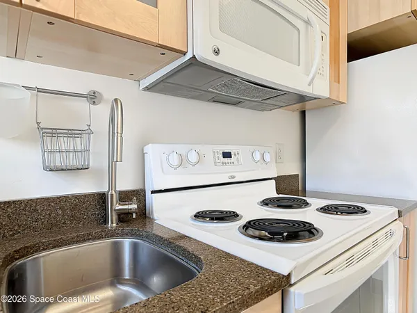 a kitchen with a stove and a microwave