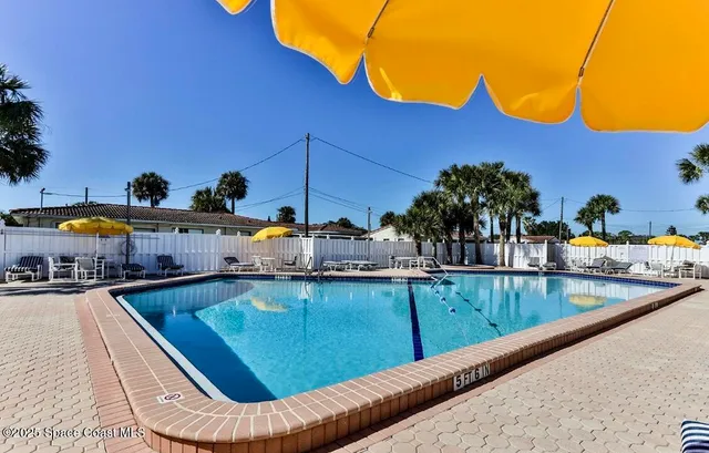 a view of swimming pool with outdoor seating and outdoor space