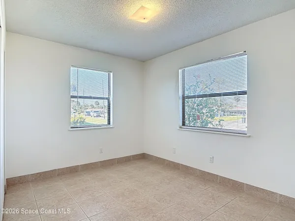 an empty room with windows