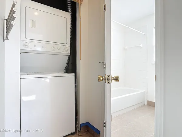 a bathroom with a bathtub and toilet