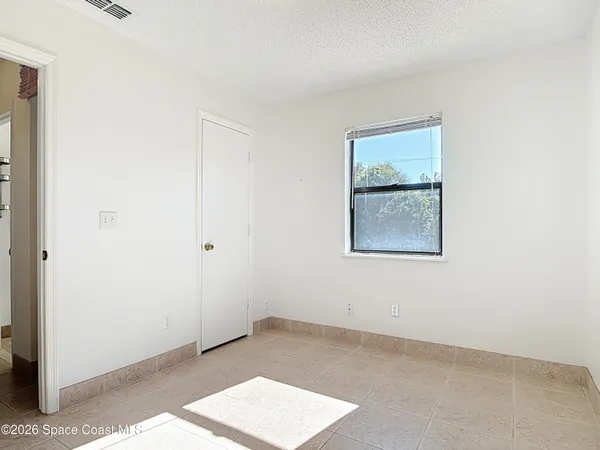 a view of an empty room with window
