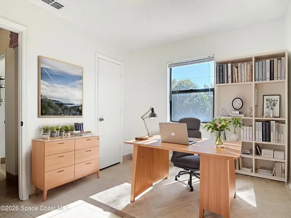 a workspace with furniture and window