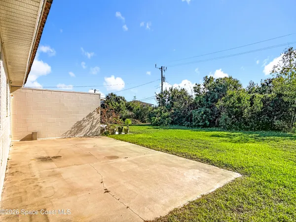 a view of a backyard of the house