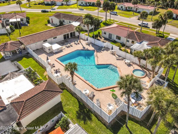 an aerial view of a house with a ocean view