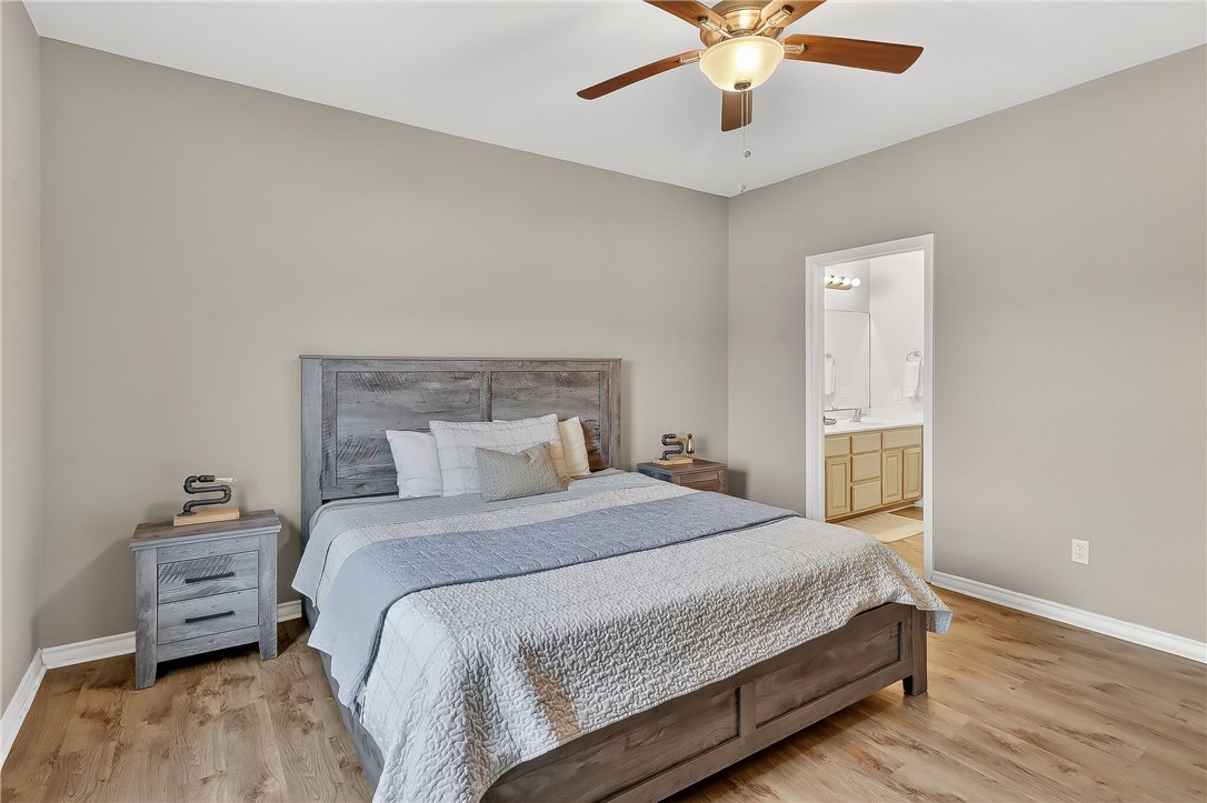 14427 Compass Street, Unit A6 Corpus Christi, TX 78418 - Photo 13 of 40 a bedroom with a bed and a chandelier