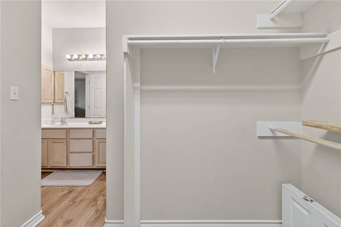 14427 Compass Street, Unit A6 Corpus Christi, TX 78418 - Photo 18 of 40 a bathroom with a sink vanity and mirror