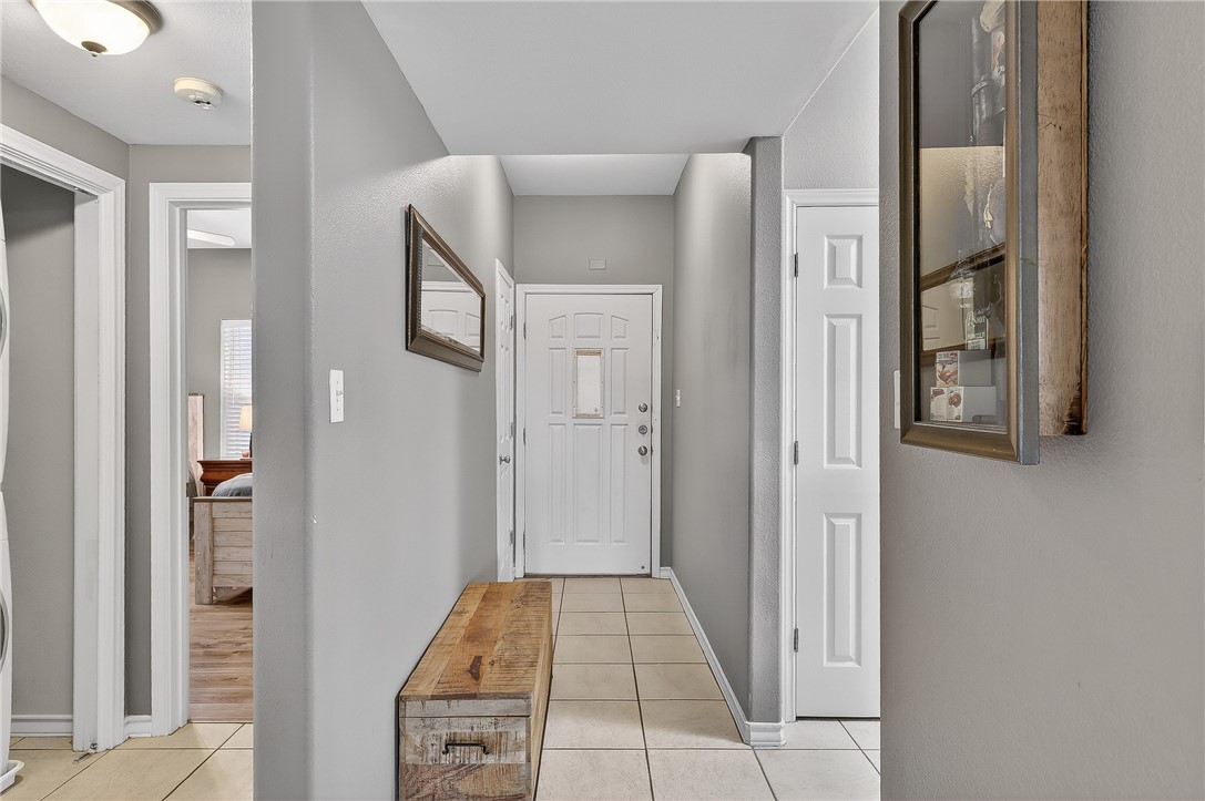 14427 Compass Street, Unit A6 Corpus Christi, TX 78418 - Photo 20 of 40 a view of a hallway with wooden floor and entryway