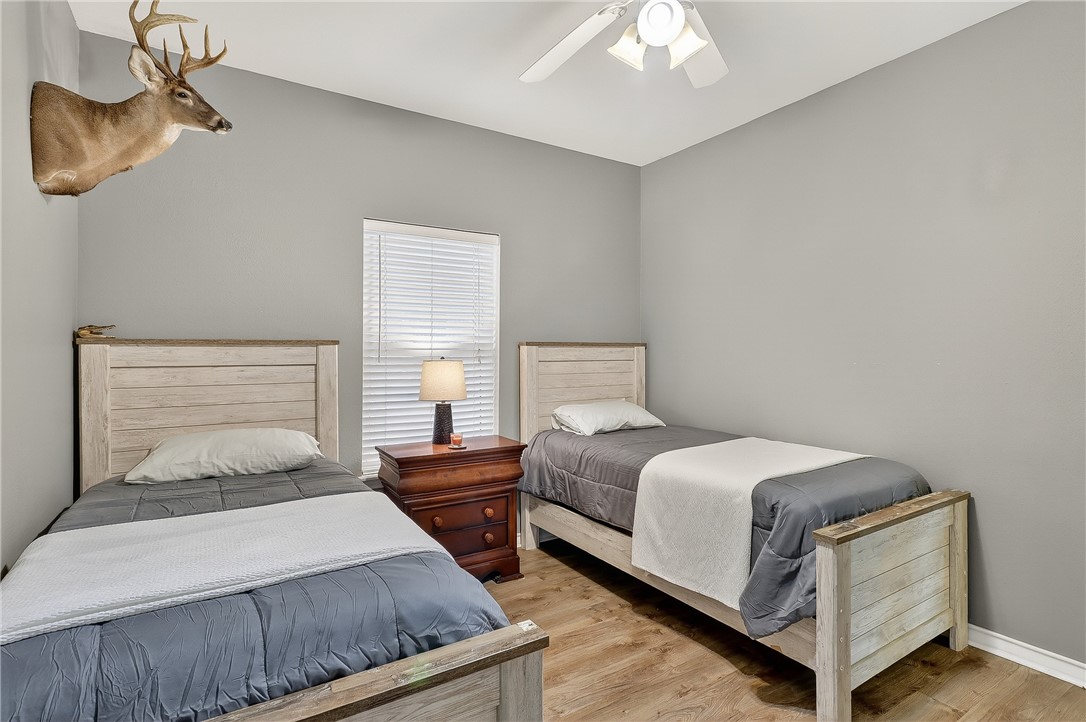 14427 Compass Street, Unit A6 Corpus Christi, TX 78418 - Photo 24 of 40 a bedroom with a bed and window