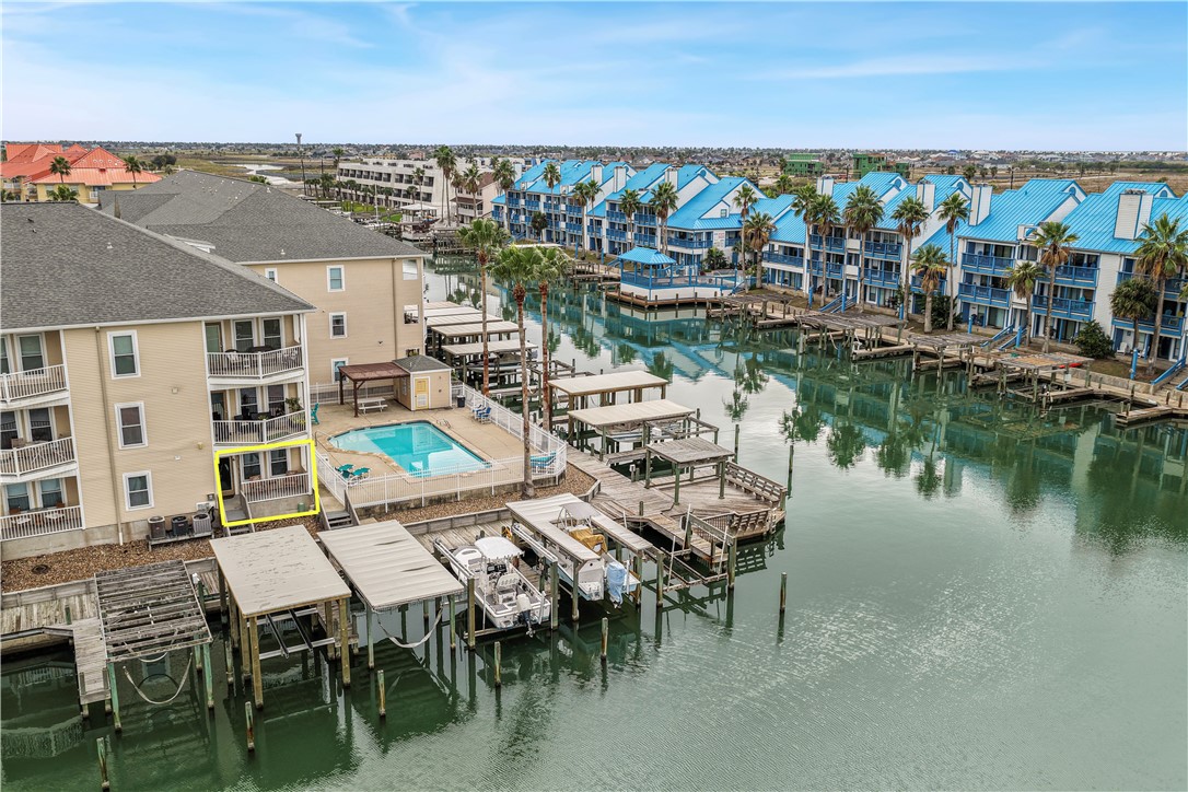 14427 Compass Street, Unit A6 Corpus Christi, TX 78418 - Photo 28 of 40 a view of a chairs and table in a terrace