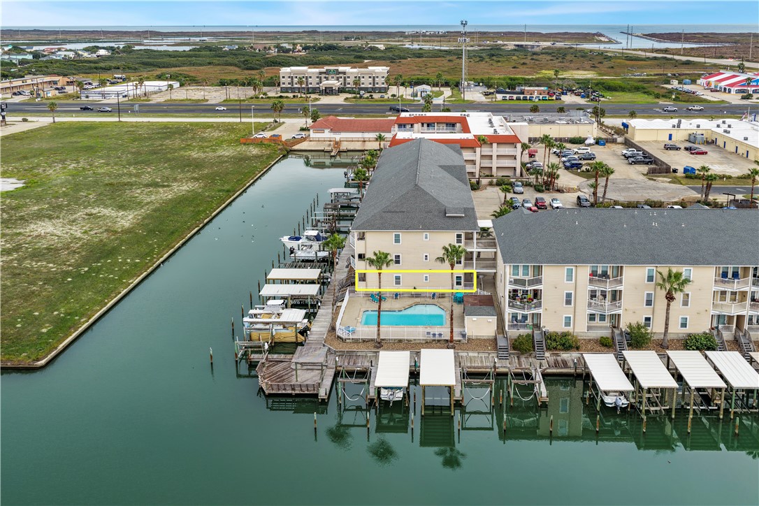 14427 Compass Street, Unit A6 Corpus Christi, TX 78418 - Photo 29 of 40 a view of a city with lawn chairs