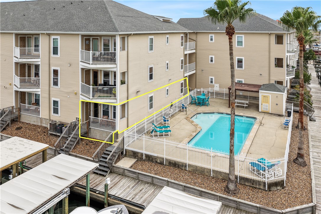 14427 Compass Street, Unit A6 Corpus Christi, TX 78418 - Photo 3 of 40 an aerial view of a house with swimming pool