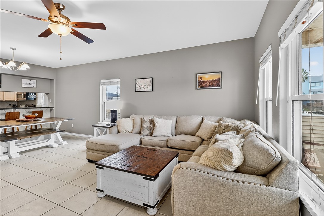14427 Compass Street, Unit A6 Corpus Christi, TX 78418 - Photo 5 of 40 a living room with furniture and a window