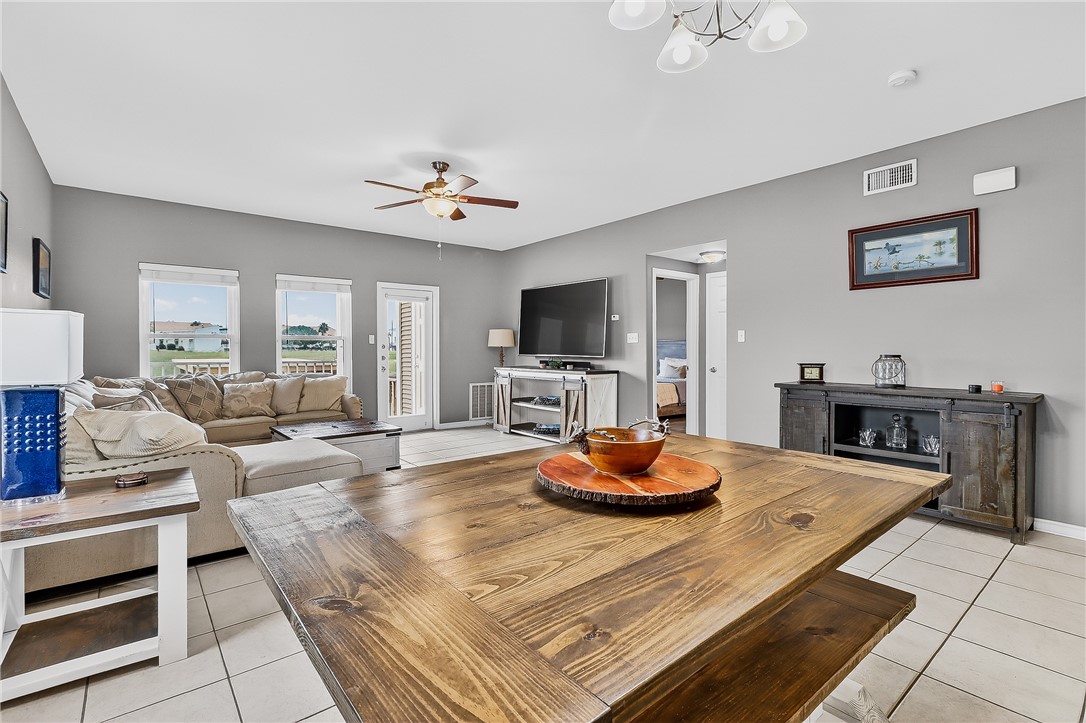 14427 Compass Street, Unit A6 Corpus Christi, TX 78418 - Photo 9 of 40 a living room with stainless steel appliances kitchen island furniture and a view of kitchen