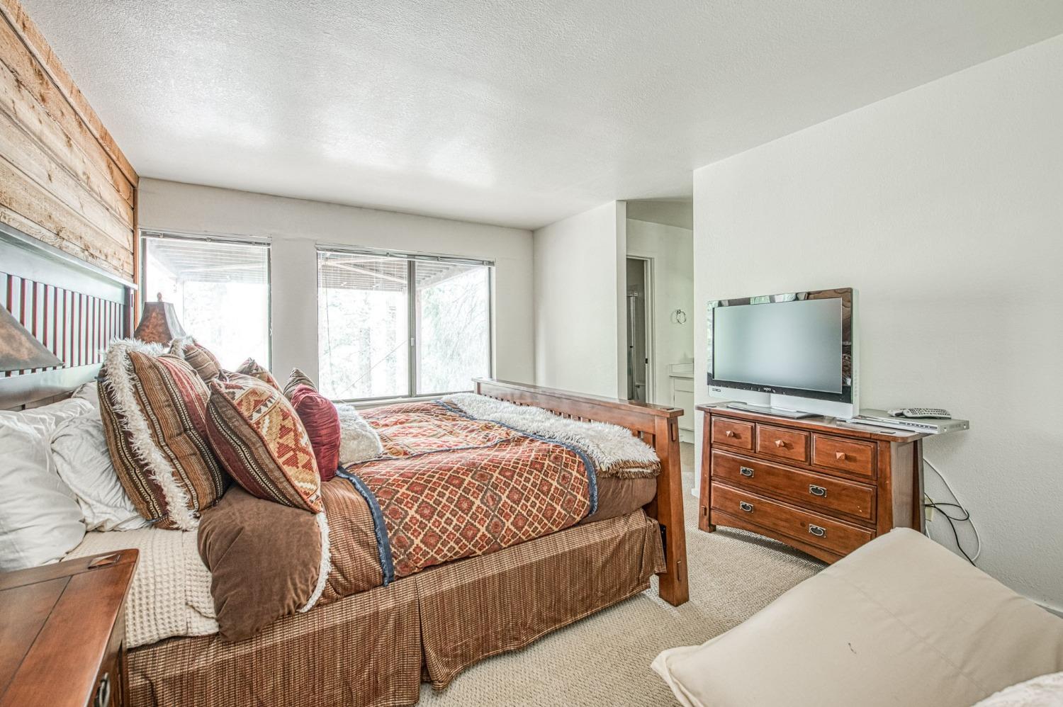 62721 Huntington Vista Road, Unit 119 Mono Hot Springs, CA 93642 - Photo 22 of 27 a bedroom with furniture and a flat screen tv