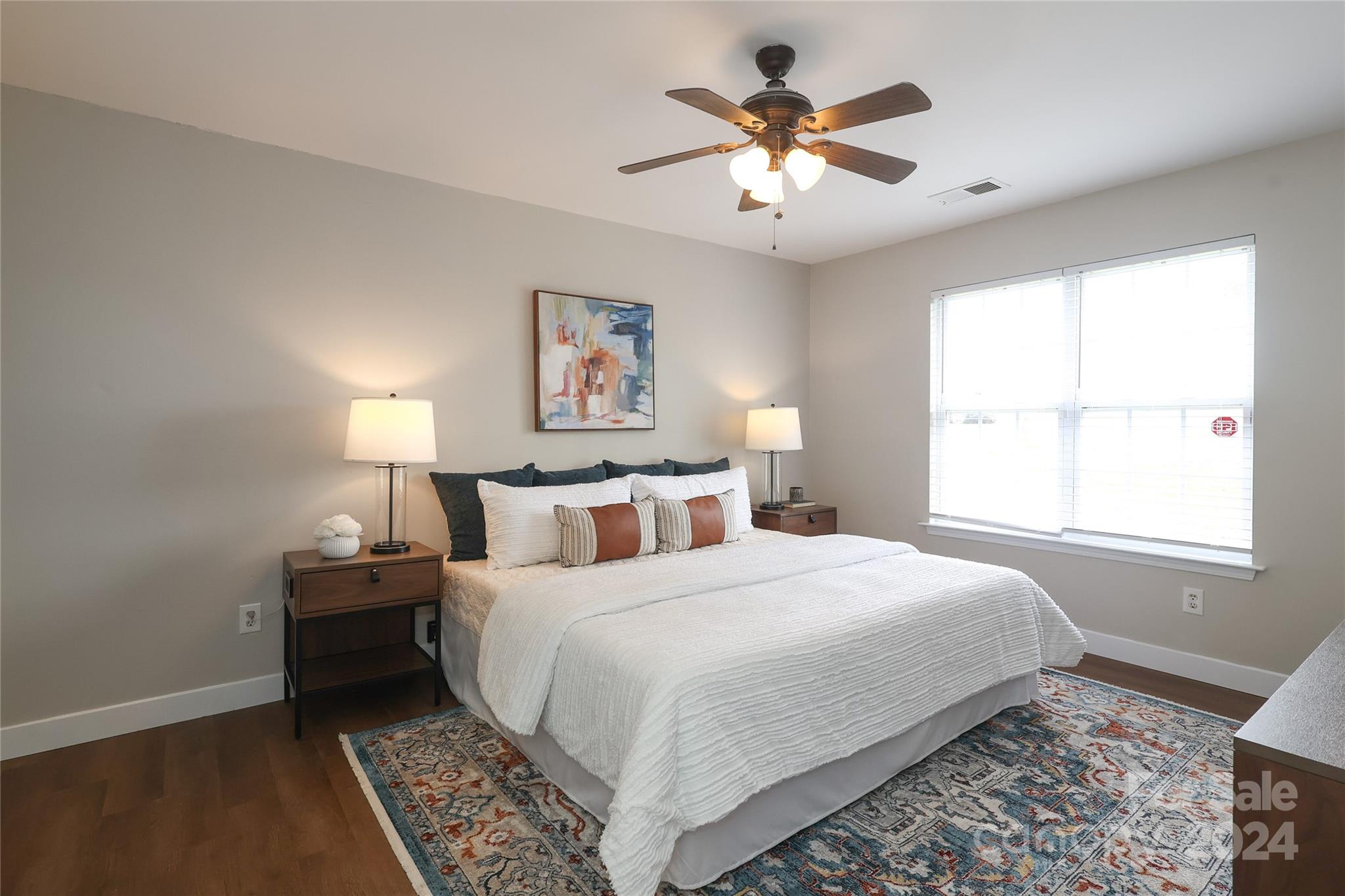 437 Radio Road Charlotte, NC 28216 - Photo 14 of 30 a bedroom with a bed and a chandelier