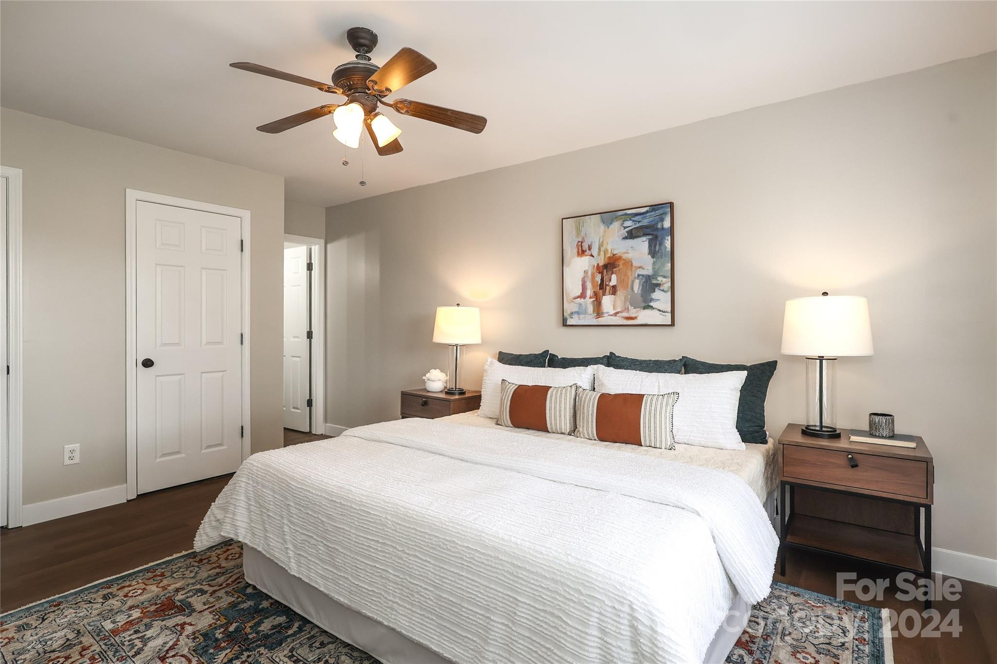 437 Radio Road Charlotte, NC 28216 - Photo 15 of 30 a bedroom with a bed and a chandelier