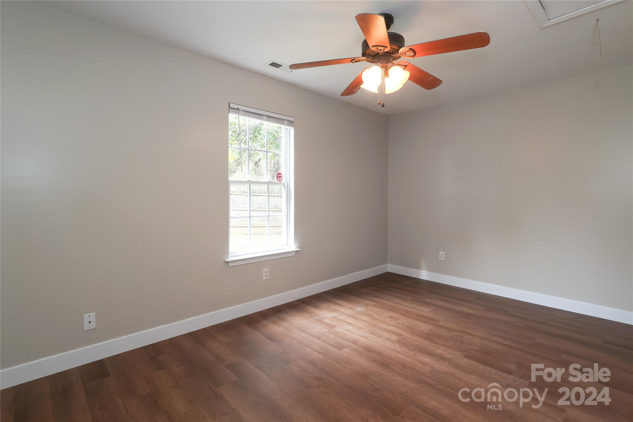 437 Radio Road Charlotte, NC 28216 - Photo 18 of 30 wooden floor in an empty room with a window