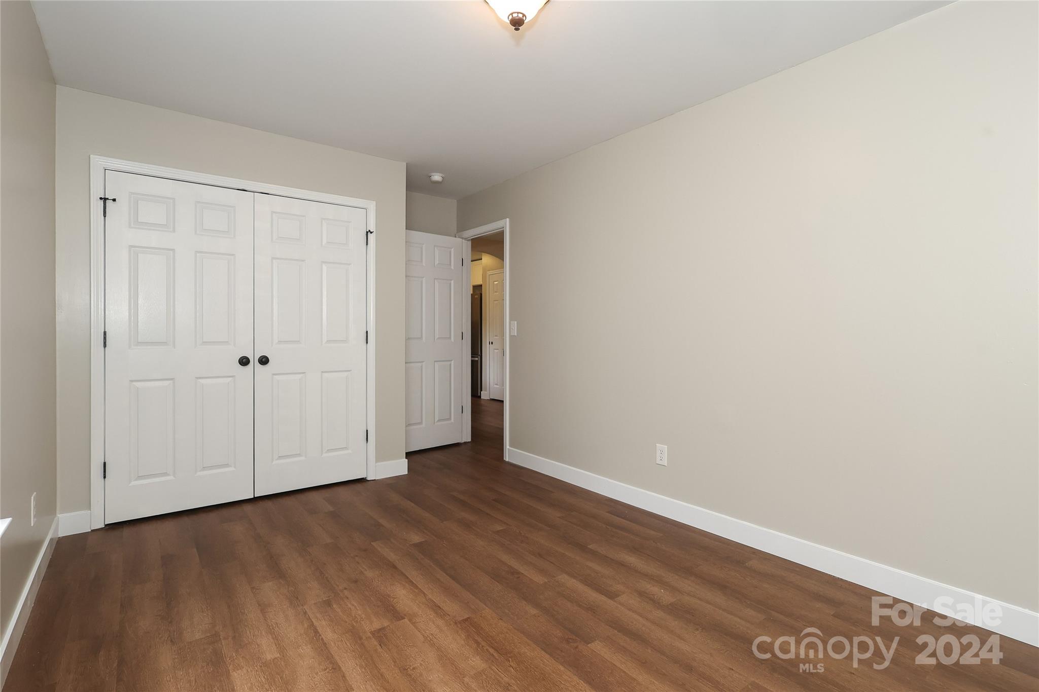 437 Radio Road Charlotte, NC 28216 - Photo 23 of 30 a view of an empty room with wooden floor