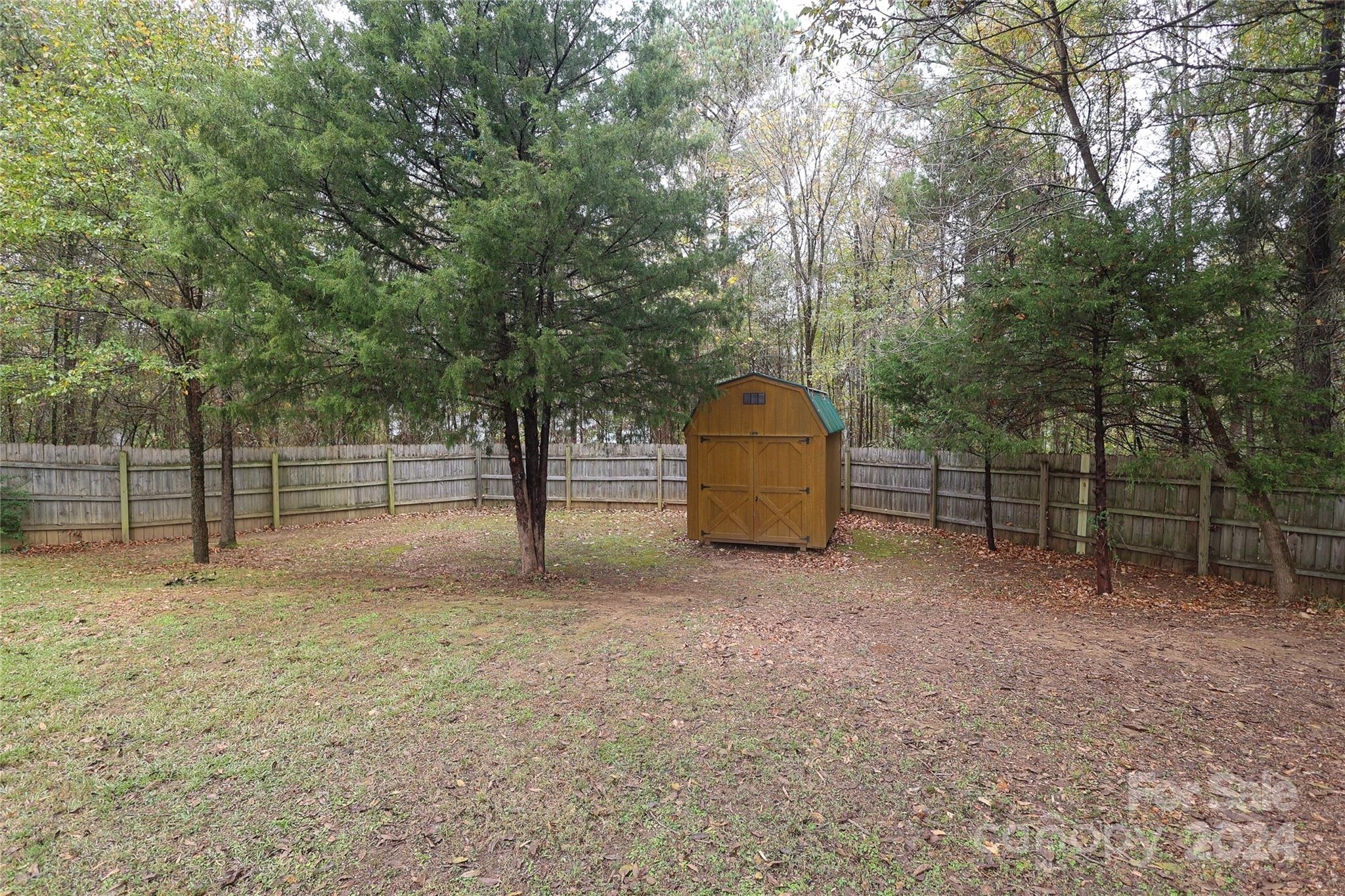 437 Radio Road Charlotte, NC 28216 - Photo 24 of 30 a view of a tiny house with a yard