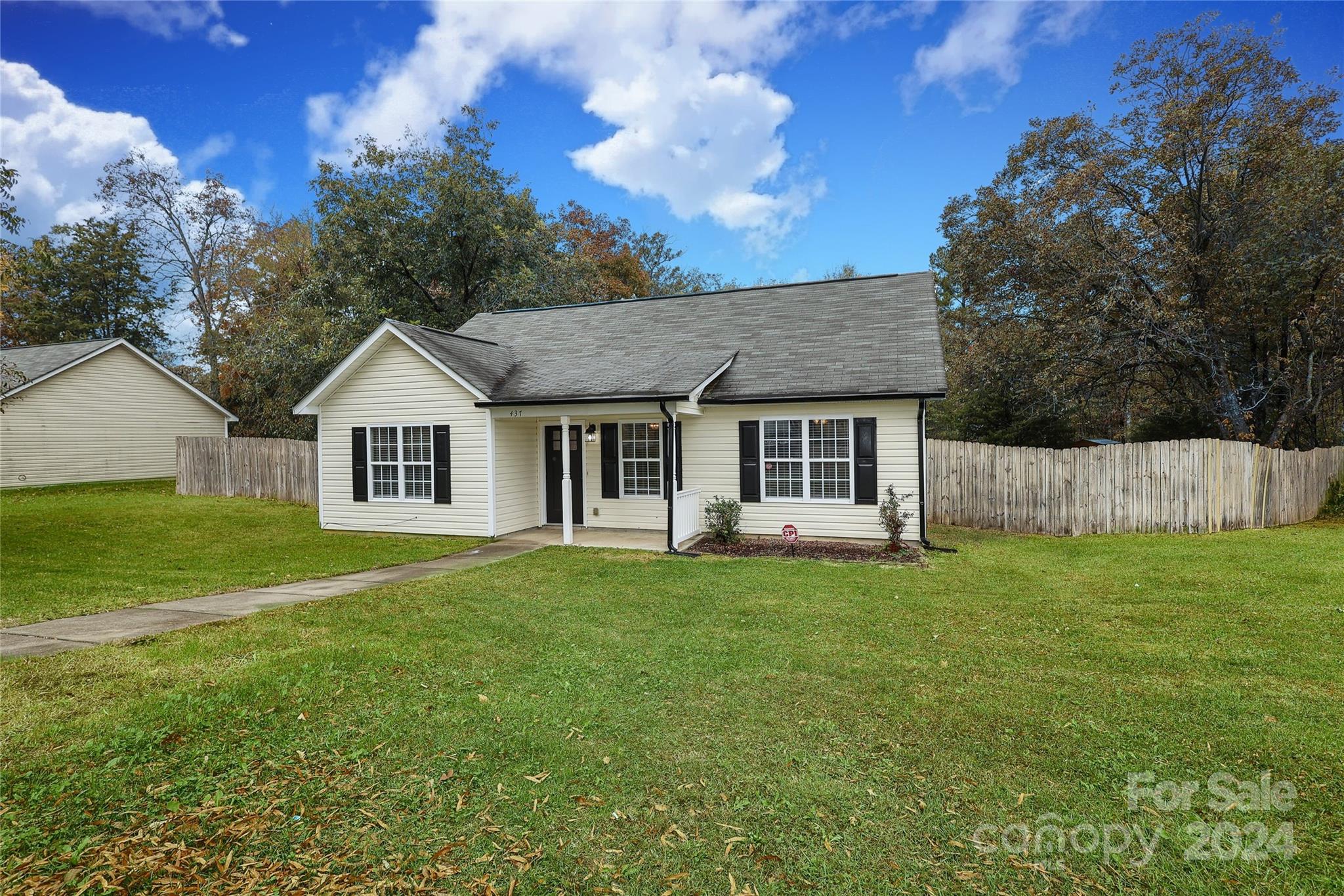 437 Radio Road Charlotte, NC 28216 - Photo 29 of 30 a front view of a house with a garden and yard