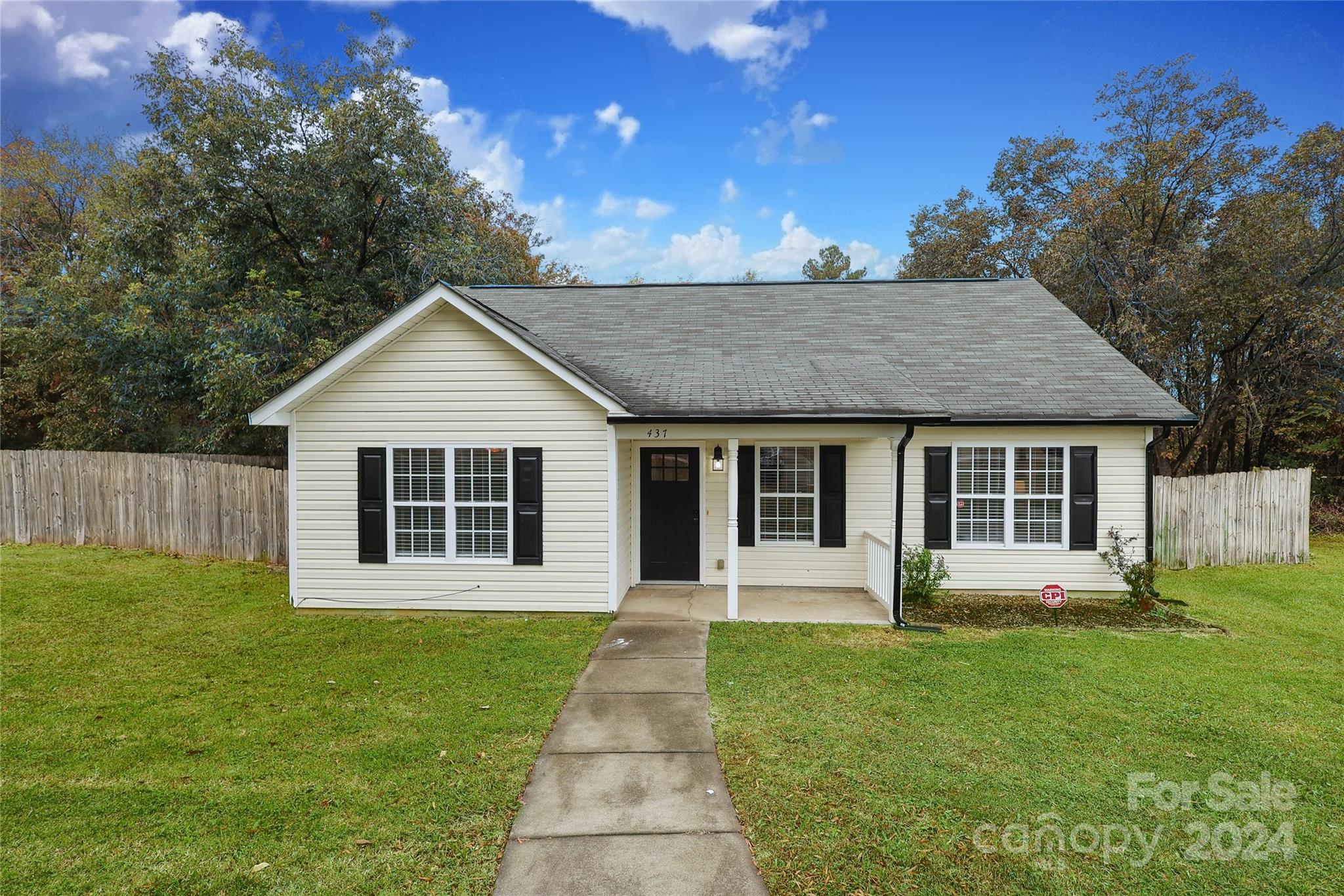 437 Radio Road Charlotte, NC 28216 - Photo 30 of 30 a front view of a house with a garden and yard