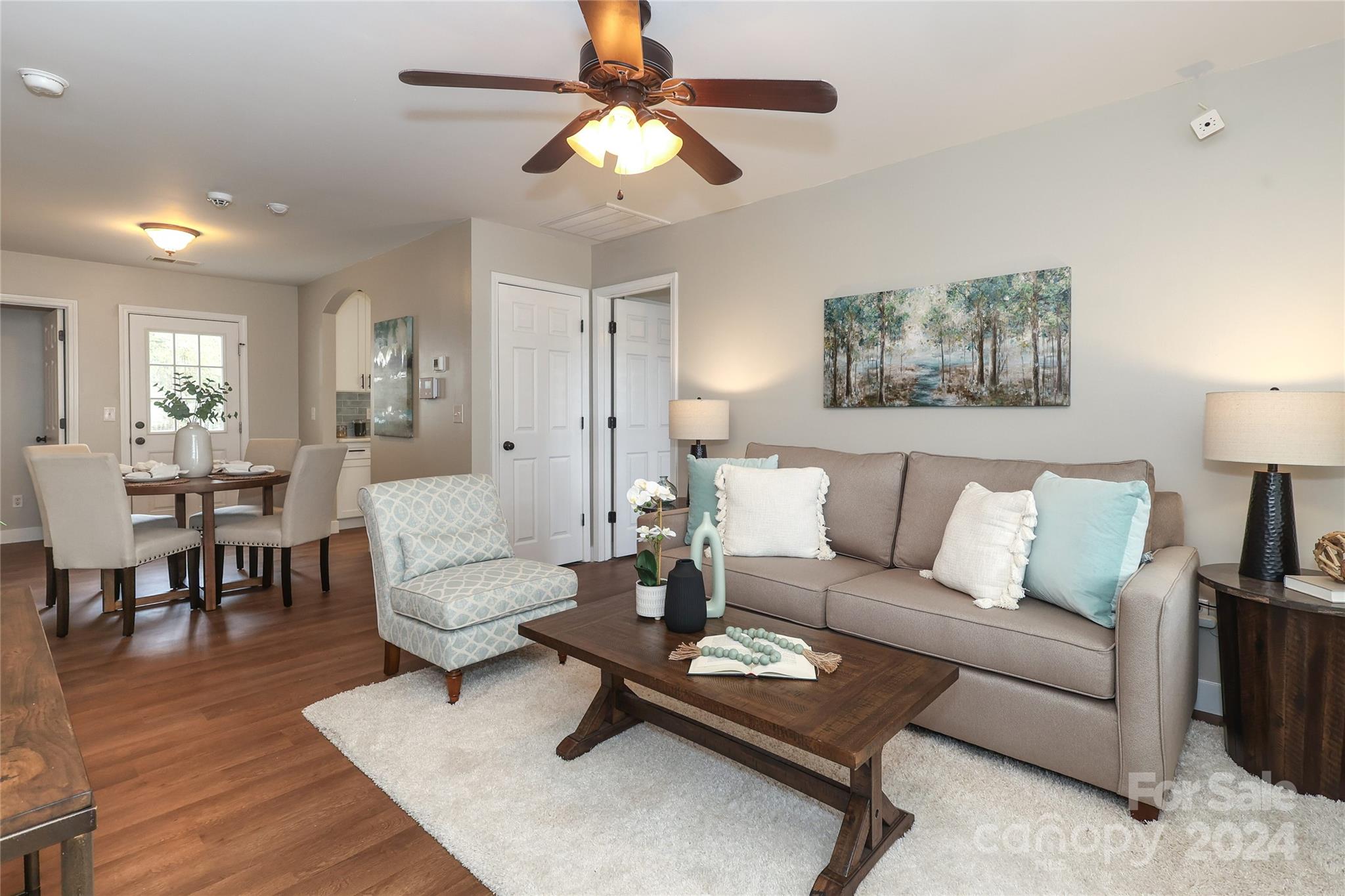 437 Radio Road Charlotte, NC 28216 - Photo 3 of 30 a living room with furniture a table and wooden floor