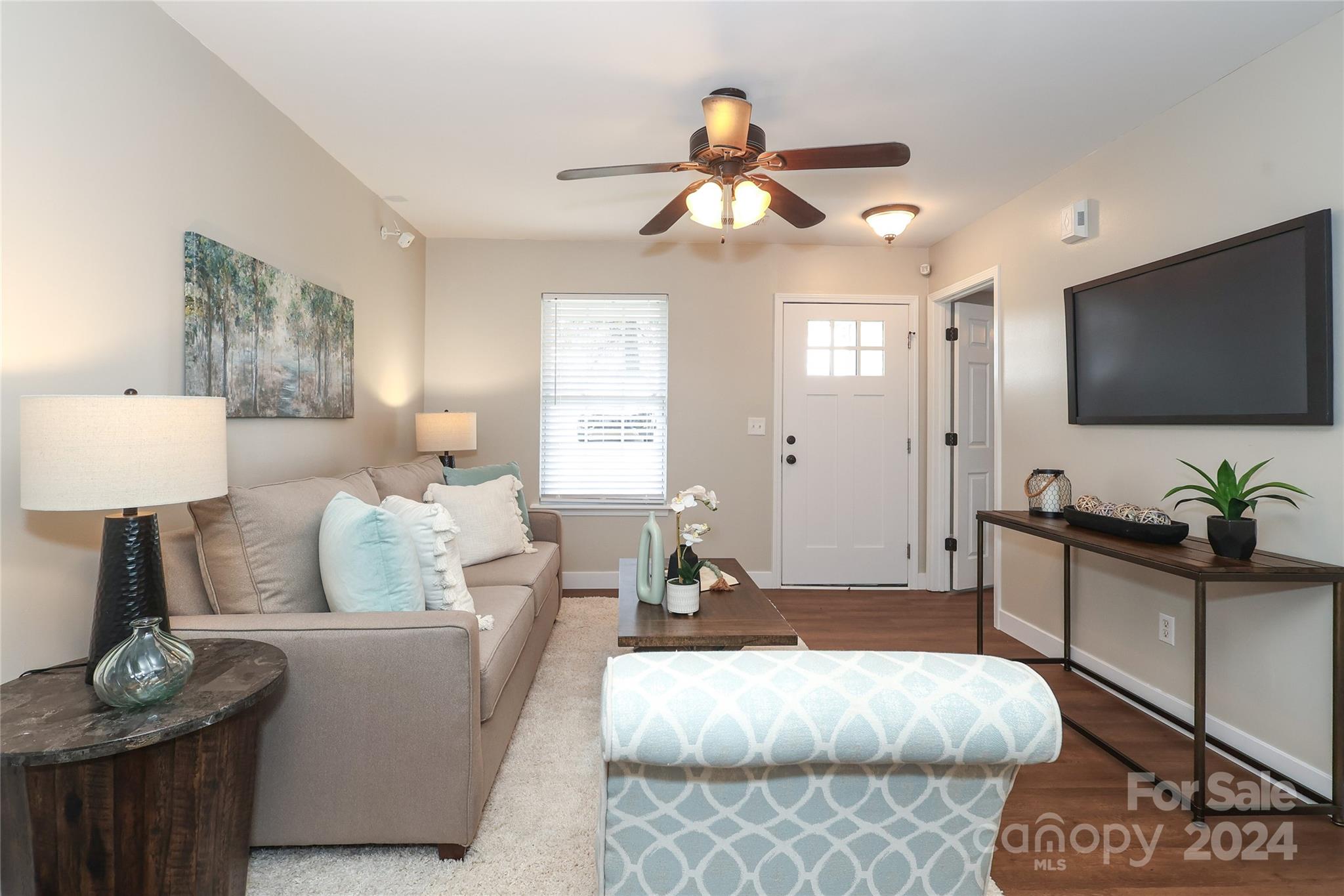 437 Radio Road Charlotte, NC 28216 - Photo 5 of 30 a living room with furniture and a flat screen tv