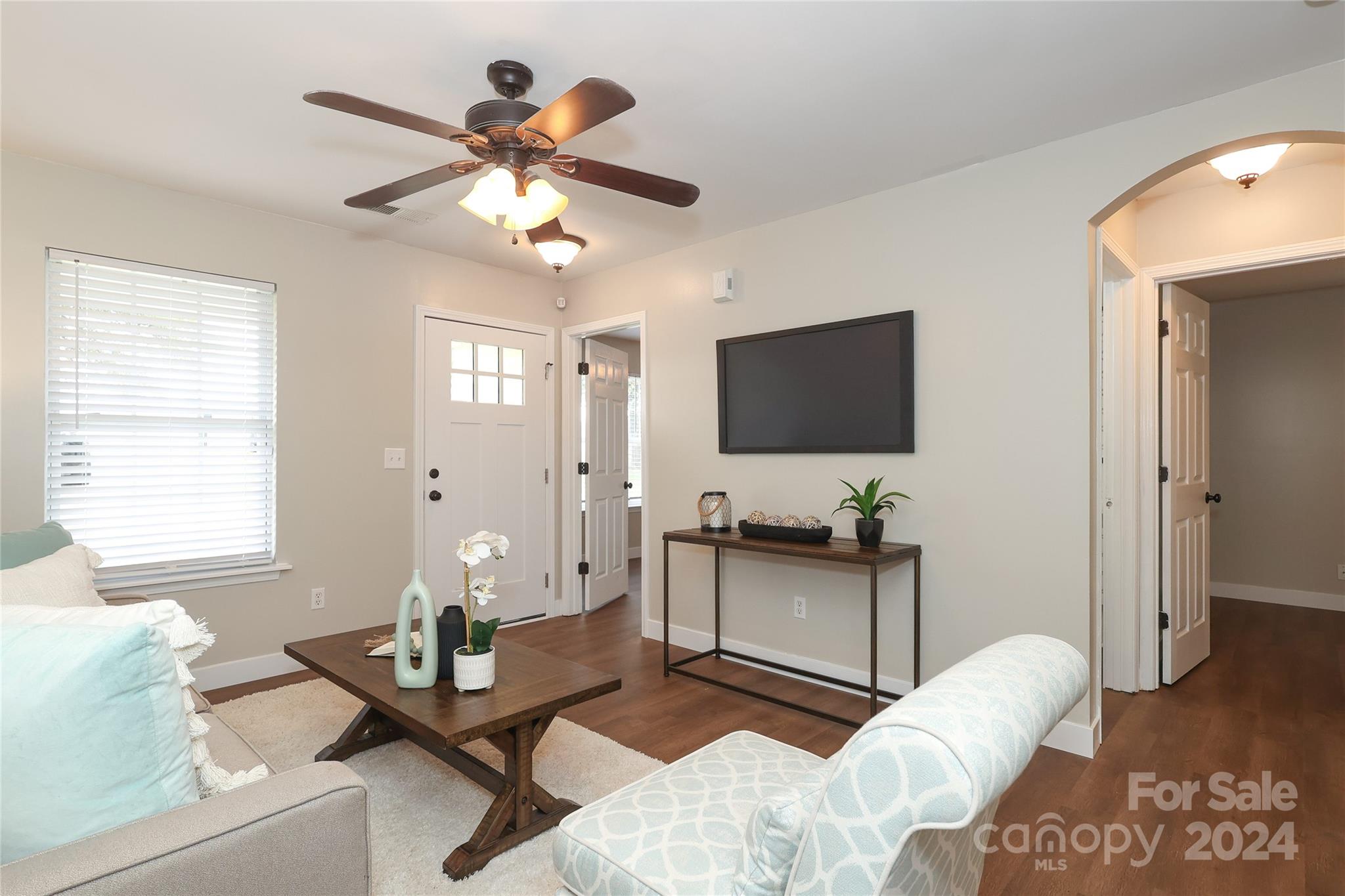 437 Radio Road Charlotte, NC 28216 - Photo 6 of 30 a living room with furniture and a flat screen tv