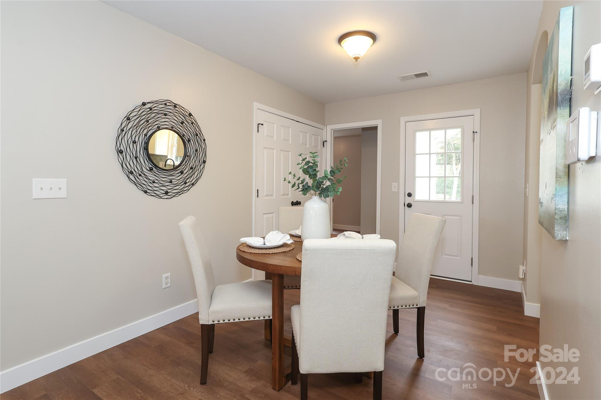 437 Radio Road Charlotte, NC 28216 - Photo 7 of 30 a view of a dining room with furniture window and wooden floor